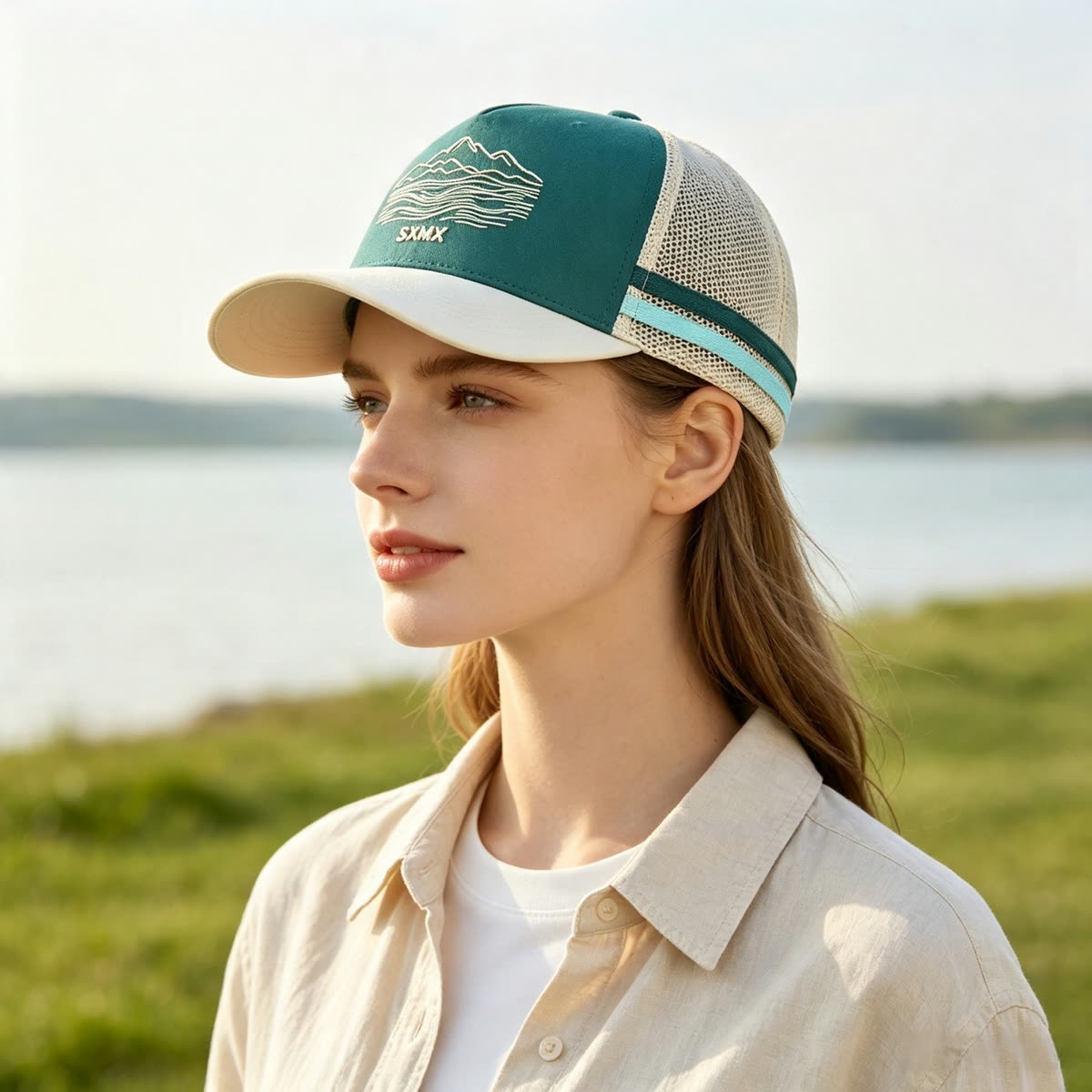 Custom Mountain Embroidery Trucker Cap with Striped Accents on model