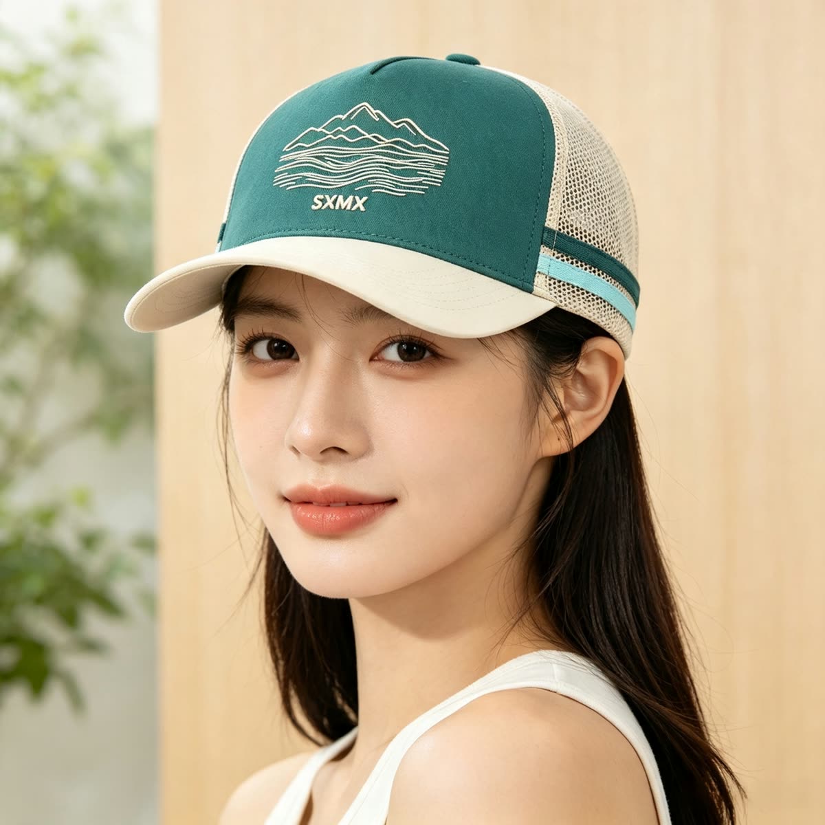 Custom Mountain Embroidery Trucker Cap with Striped Accents on model