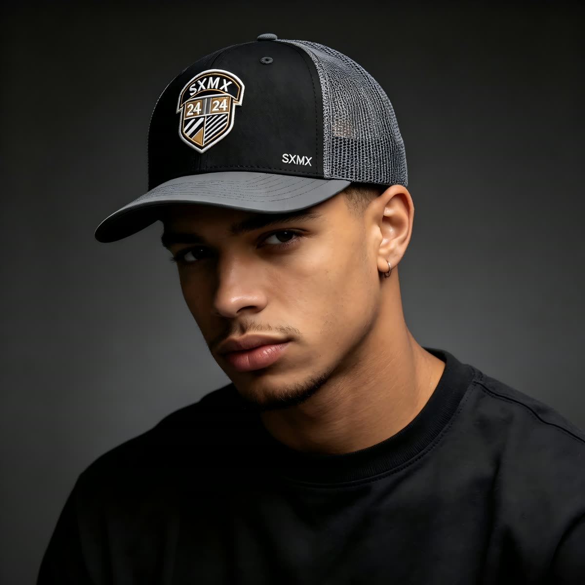 Custom Black Shield Patch Trucker Cap with Mesh Back on model