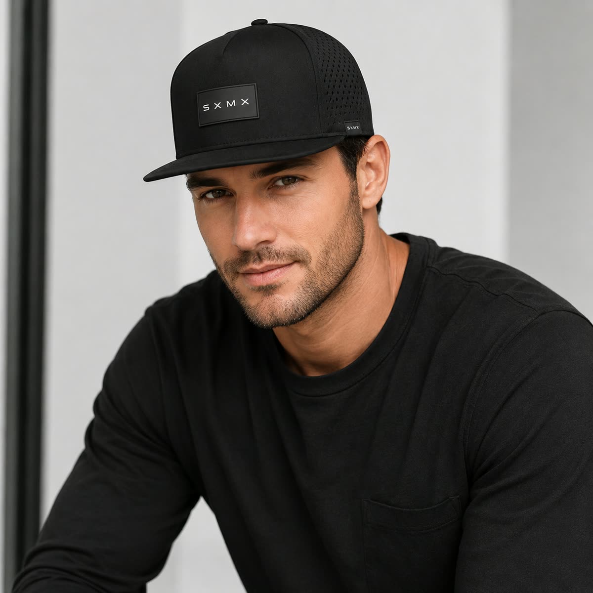 Custom Black Topographic Trucker Cap with Rubber Patch on model