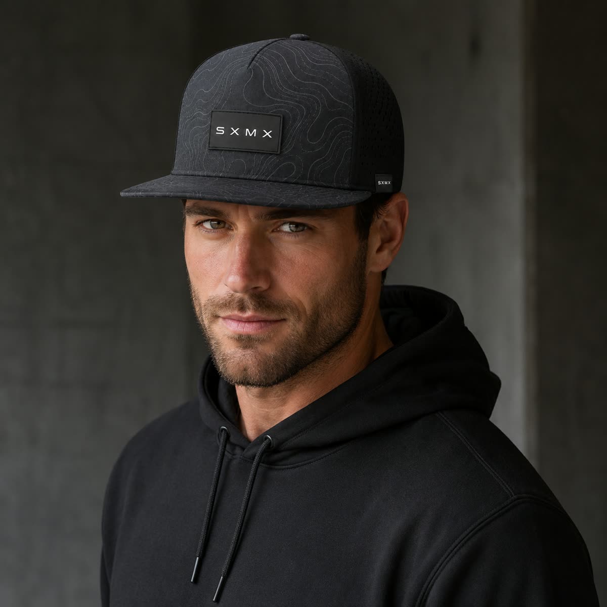 Custom Black Topographic Trucker Cap with Rubber Patch on model